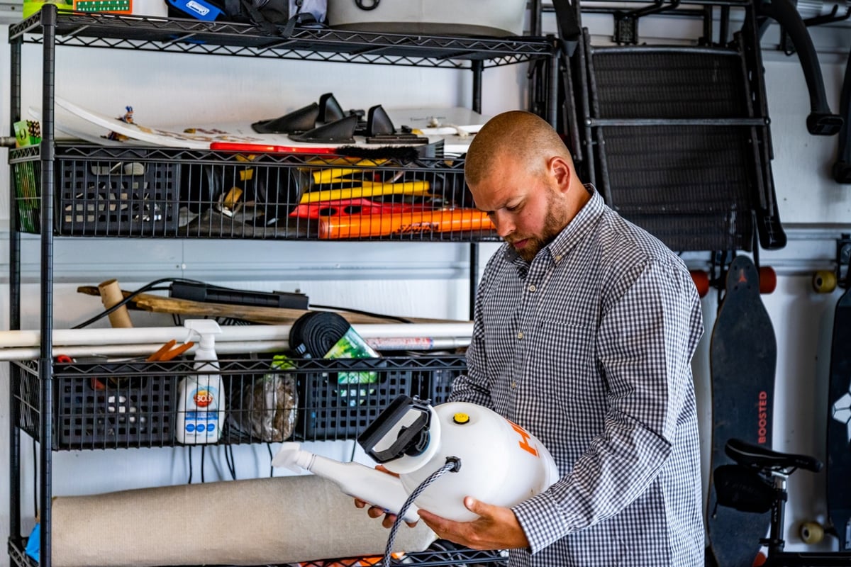 customer reads pest control label in garage