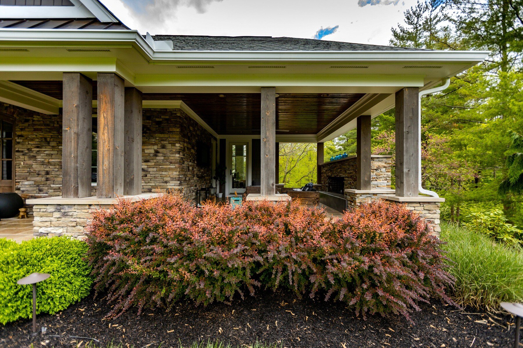 house porch landscape shrubs mulch landscape lights