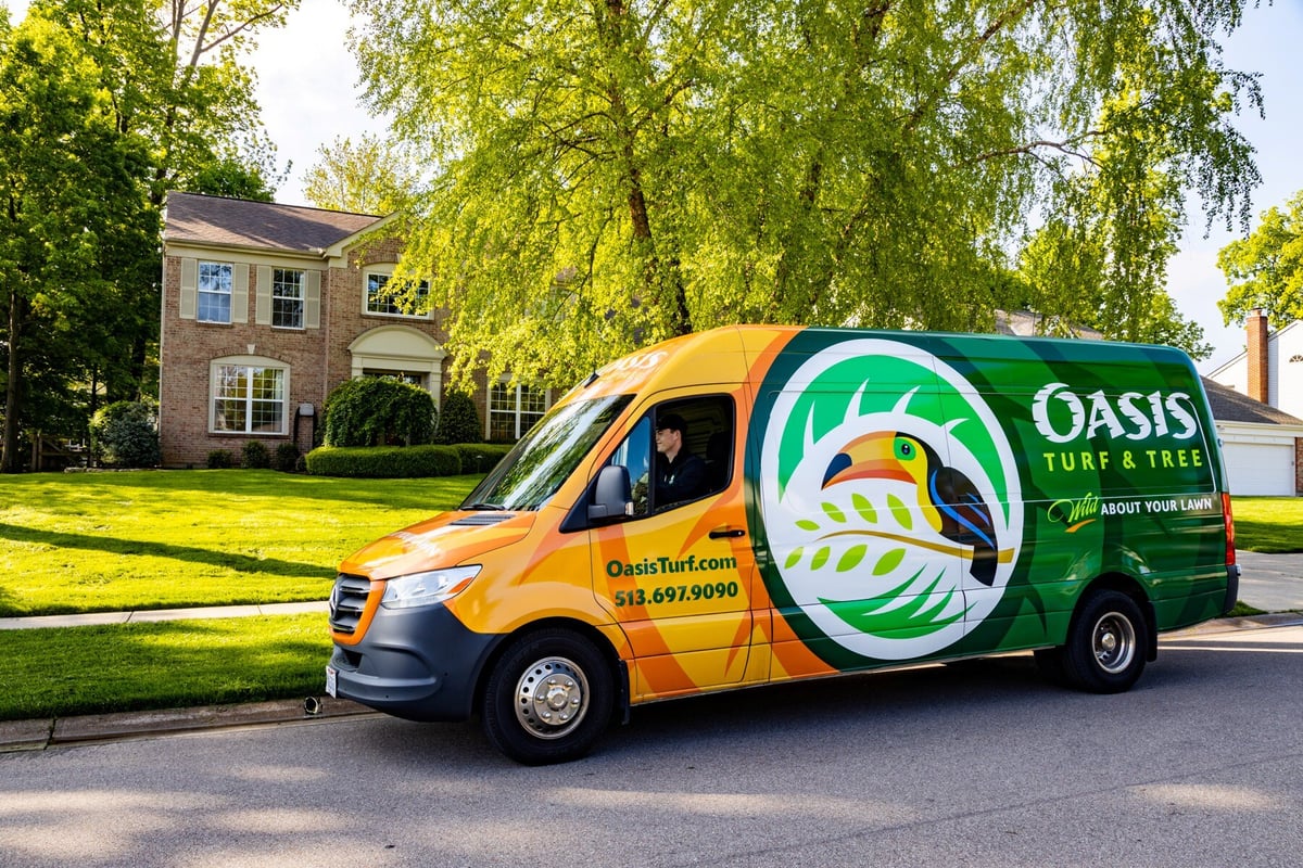 lawn care truck parked in front of home