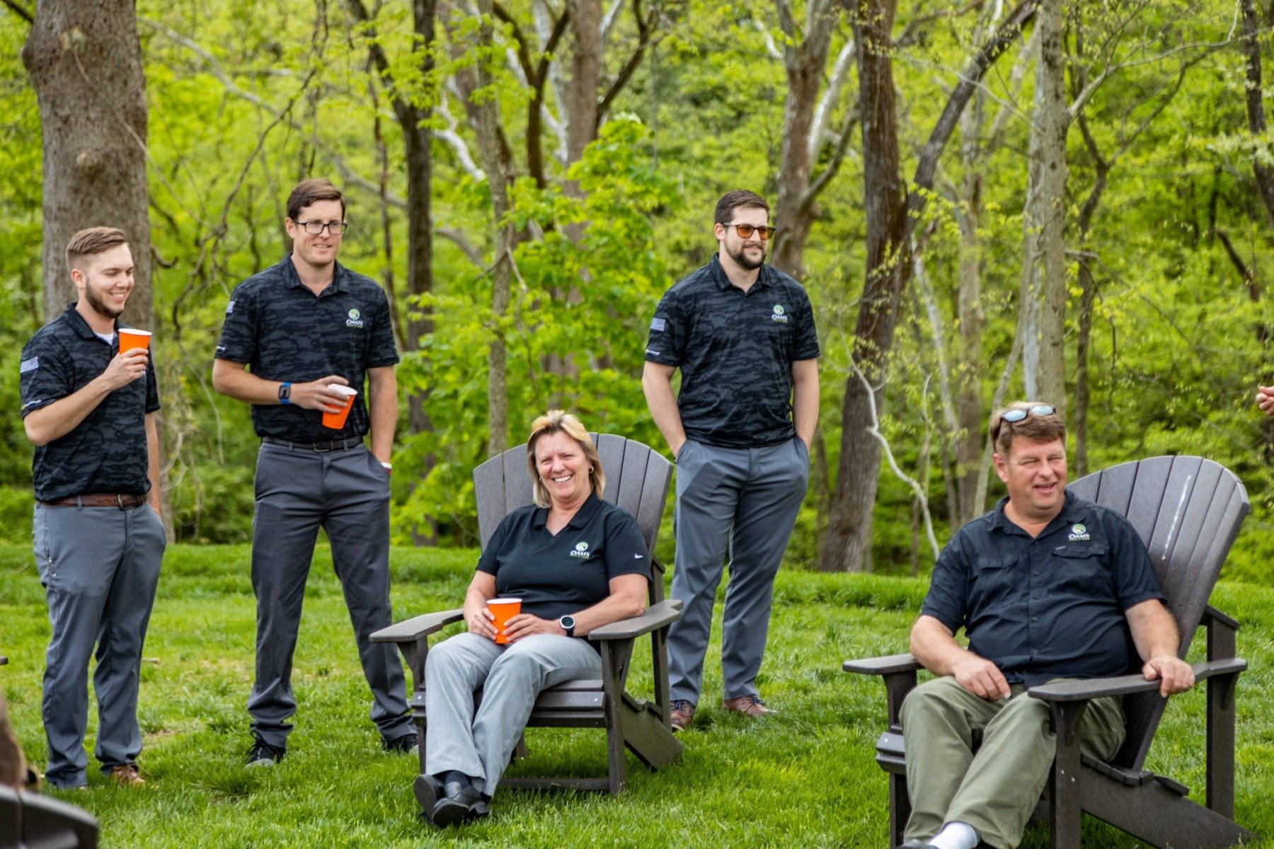 members of oasis turf & tree