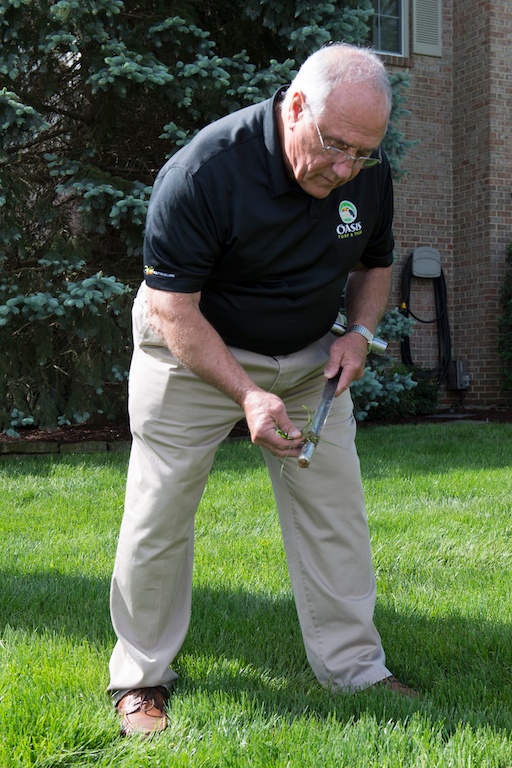 lawn care expert does a soil test