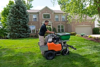 Oasis Turf & Tree technician performing lawn care services in Ohio