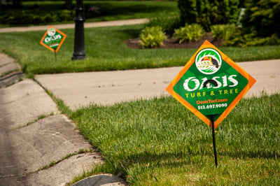 Oasis lawn care sign in lawn in Cincinnati