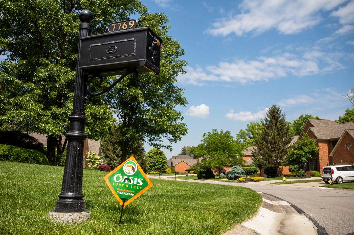 Oasis Turf & Tree lawn care sign in lawn in Cincinnati
