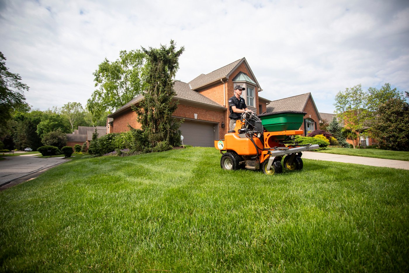 lawn technician applying crabgrass preventer