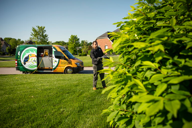 Oasis lawn care technician and van