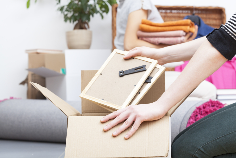 People packing up their house to move