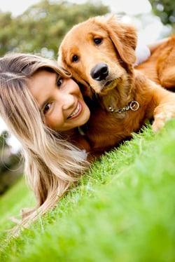 Girl with a cute puppy dog outdoors