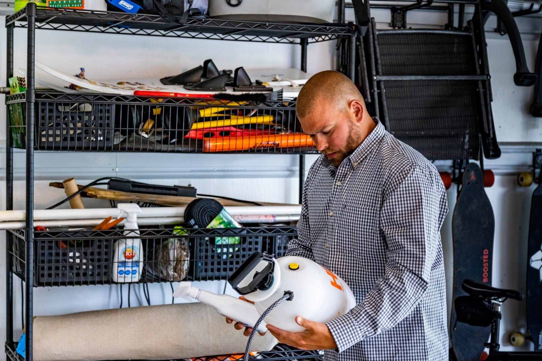 Homeowner looking at pest control chemicals