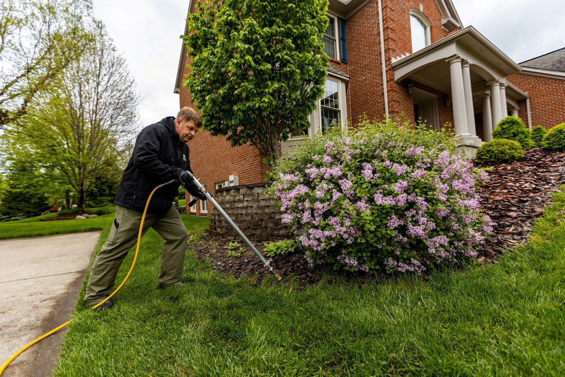 lawn care technician performs soil test