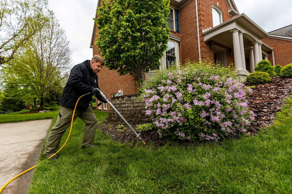 lawn care team performs soil test