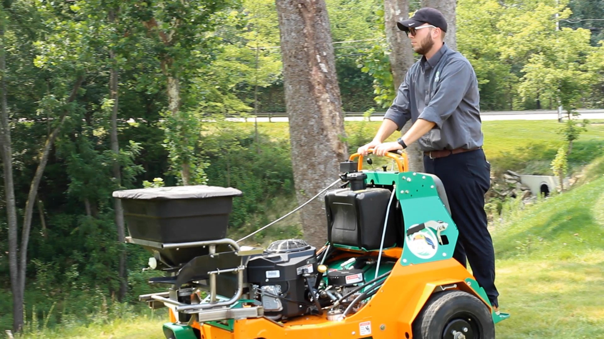 lawn aeration being performed by a lawn care technician